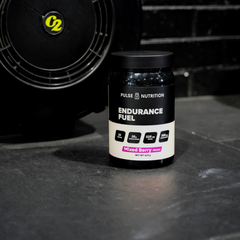 Endurance Fuel Mixed Berry tub in a training setting
